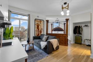 a living room with a couch and a table at Maison Paris- Quartier des Spectacles in Montreal