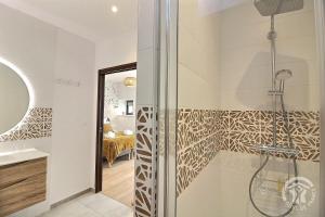a bathroom with a shower with a glass door at Le val d'ic in Pordic +41 photos