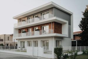 a building with balconies on the side of it at Arca Guest House in San Trovaso