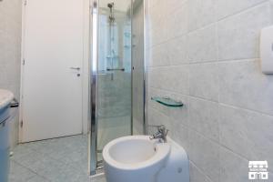 a bathroom with a sink and a shower at AL LAGO by Design Studio in Bellano +20 photos