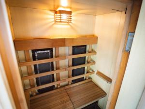 a small closet with a light on the wall at バケーションイン伊豆高原 in Ito +54 photos