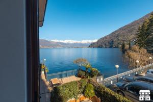 a view of a lake from a balcony at AL LAGO by Design Studio in Bellano