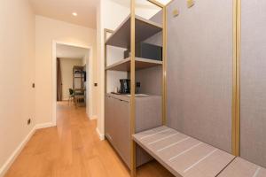 a room with a book shelf and a hallway at Best Western Hotel Arya in Sirmione