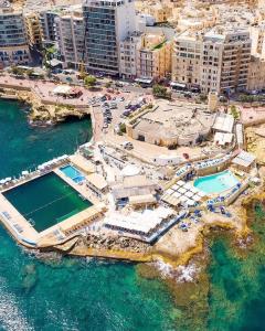 an aerial view of a resort in the water at Seaview luxury flat 4 bedrooms in Sliema