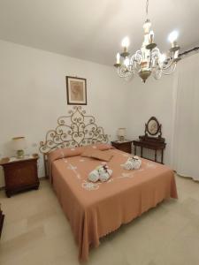 a bedroom with a bed with two towels on it at I Tre Archi in Suvereto