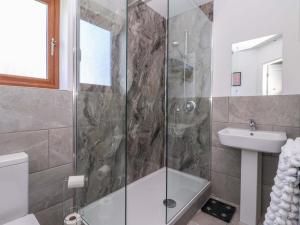 a bathroom with a shower and a sink at Star Carr Lakes in Great Driffield +14 photos