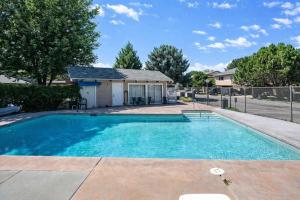 a swimming pool in front of a house at Game Night Downtown -BSU -Slots - Pool - 100 games in Boise