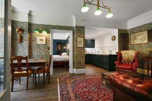 a living room with a kitchen and a dining room at Foyers Lodge in Foyers