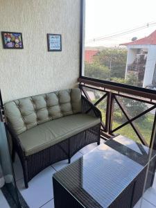 a living room with a couch and a table at Flat on Mount Castelo Sairé in Sairé +27 photos