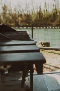 a piano sitting on a table in front of a fence at A frame CHILL House in Brasina +32 photos