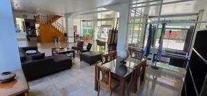 a living room with a couch and a table at Hotel del Sol in La Plata