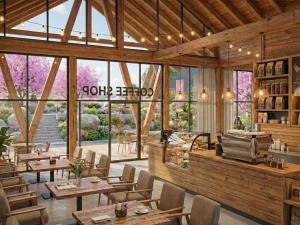 a restaurant with wooden tables and chairs and windows at Wisdom Park Caravan Camp Pattaya in Ban Khao Mai Kaeo