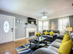 a living room with a couch and a table at Private 2BR 10 Min to Airport & Downtown in Jacksonville
