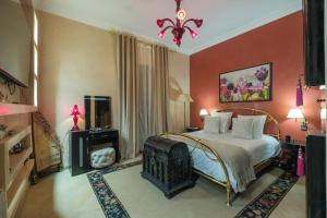 a bedroom with a large bed in a room at Riad Malak Palmeraie in Marrakesh +122 photos