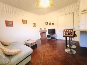 a living room with a couch and a fireplace at Le 5BG Signature in Dunkerque