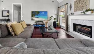 a living room with a couch and a fireplace at Master Suite with Private Jacuzzi Tub in McDonough