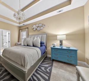 a bedroom with a blue bed and a blue dresser at Master Suite with Private Jacuzzi Tub in McDonough