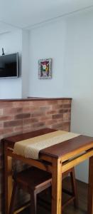 a wooden table with a mattress on top of it at Central Apartment 03 in Ouro Preto +2 photos