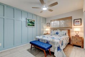 a bedroom with a bed and a ceiling fan at Indian Rocks Beach West Side Bungalow in Clearwater Beach