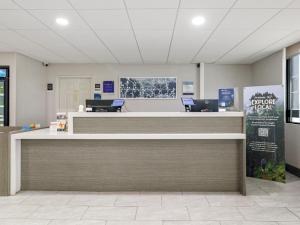 a lobby with a reception desk with a sign that says you dont fight at Sleep Inn Chambersburg in Chambersburg