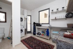 a laundry room with a washer and dryer at Elegant Maltese Townhouse in Attard +32 photos
