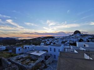 a view of a city at sunset at Meltemi Chora Amorgos Panoramic View in Amorgos