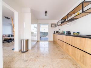 a kitchen with white walls and a counter top at Sara in Les Issambres