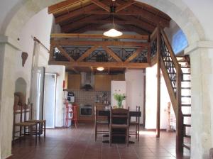 a kitchen and dining room with a table and chairs at Stathis Villa in Vamos
