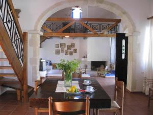 a dining room and living room with a table at Stathis Villa in Vamos
