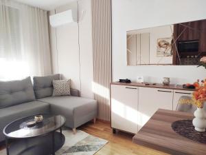 a living room with a couch and a table at City Studio in Smederevo