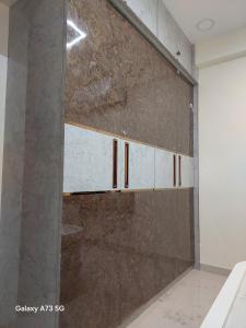 a sliding glass door in a room at The Pinnacle Retreat , Jaitala in Nagpur +49 photos