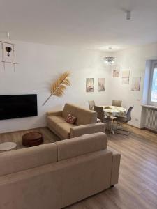 a living room with a couch and a table at Pepe Apartments Asy in Castellammare di Stabia