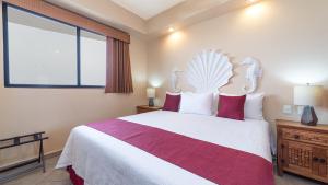 a bedroom with a large bed and a window at Rubi 805 1 BR 1BA Condo Phase 1 @ Las Palomas in Puerto Peñasco +20 photos