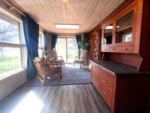 a kitchen in a tiny house with a table and chairs at Selway View Cabin in Corvallis +9 photos