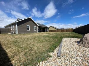 a house in a yard with a grass field at Comfy 4 Bdrm House with Air Conditioning in Corvallis