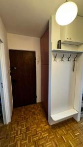 a room with a door and a wooden floor at Cracow View Rooms in Krakow