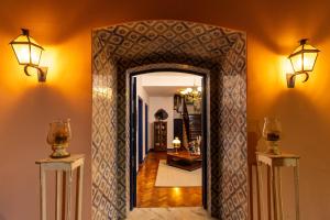 a hallway with an archway in a house at Altos de Colombo Guest House Boutique - Soft Opening in Rio de Janeiro +35 photos