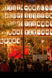 a crowd of people standing in front of a building at HARERUYA Inn SHINJUKU in Tokyo