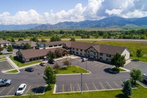 an aerial view of a building with a parking lot at MountainView Lodge and Suites in Bozeman