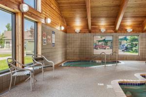 a room with a swimming pool in a building at MountainView Lodge and Suites in Bozeman