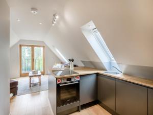 a kitchen with a sink and a stove at Pond View Loft in Sudbury