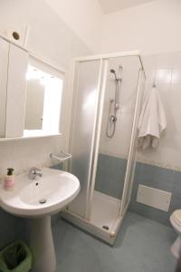 a bathroom with a shower and a sink and a toilet at Villa Erry in Trani +88 photos