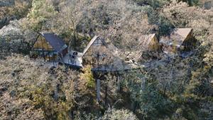 an aerial view of a house on a hill at Cabaña Gokotta, Punta del Bosque in Huasca de Ocampo