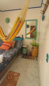 a bedroom with a hammock in a room at Antigua Hostal in Bucaramanga