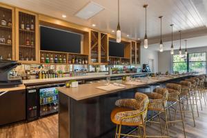 a bar with bar stools in a restaurant at Cambria Hotel Copper Mountain in Frisco