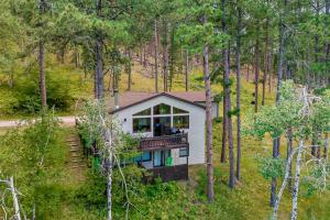 an aerial view of a house in the woods at Happy Jack in Rapid City