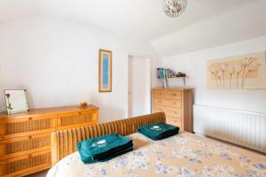 a bedroom with a bed with two bags on it at 1 Bed in Elton oc-dctco in Elton