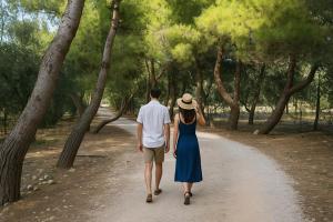 a man and a woman walking down a dirt road at Tenuta Molino di Mare- Ecoresort in Rodi Garganico