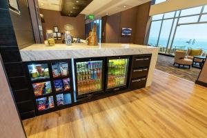 a drink bar in a hotel lobby with drinks at Hampton By Hilton Antofagasta in Antofagasta