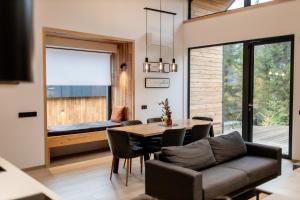 a living room with a table and a couch at Veres Hill in Tukhlya